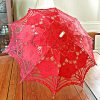 red colored lace parasol.