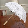White battenburg lace parasol.